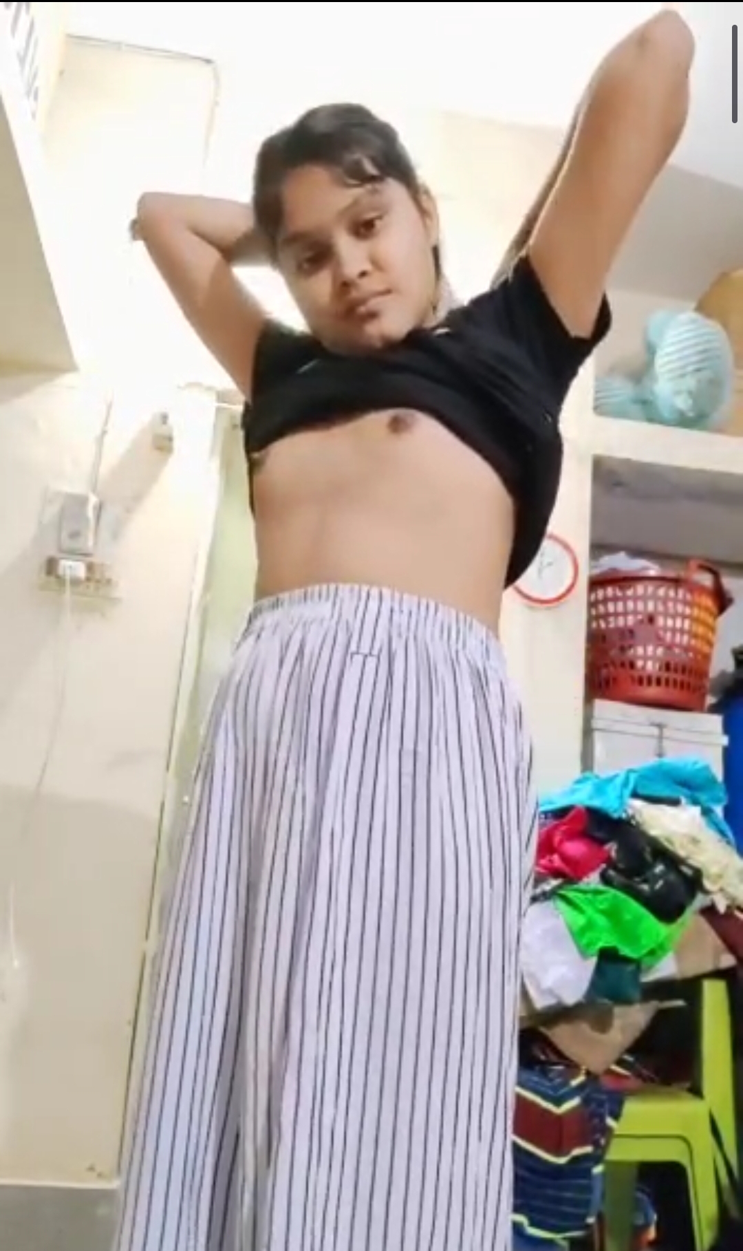 Cute small girl showing small boobs and pussy